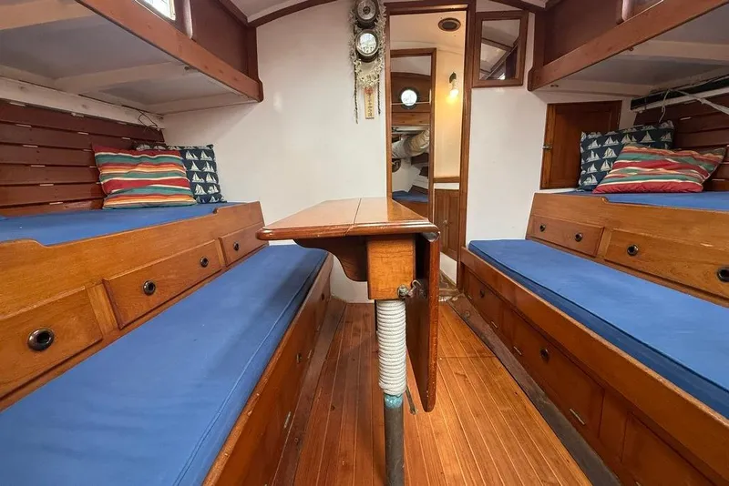Slide: The Image of Vintage 1965 boat interior with wooden furnishings and blue cushions. - 20