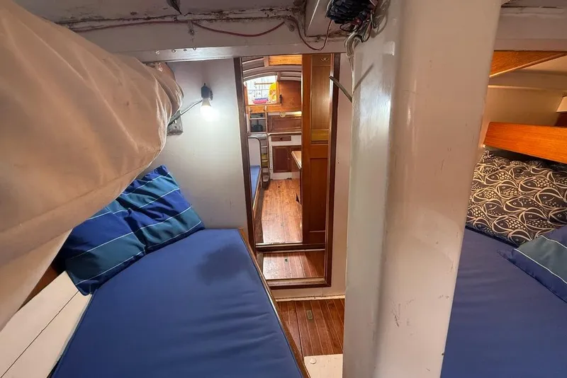 Slide: The Image of Interior of a 1965 Vintage model 34 boat with cozy sleeping quarters. - 21