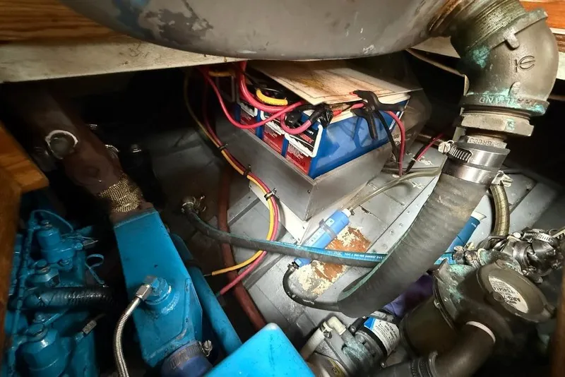 Slide: The Image of Vintage 1965 engine compartment with wiring and mechanical components. - 35