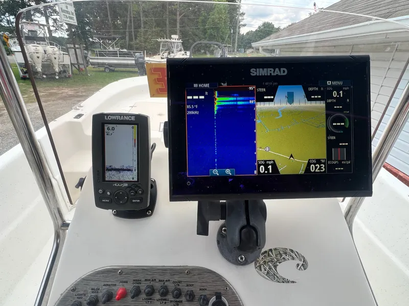 Slide: The Image of Navigation systems on a 2015 Carolina Skiff 218 DLV boat. - 12