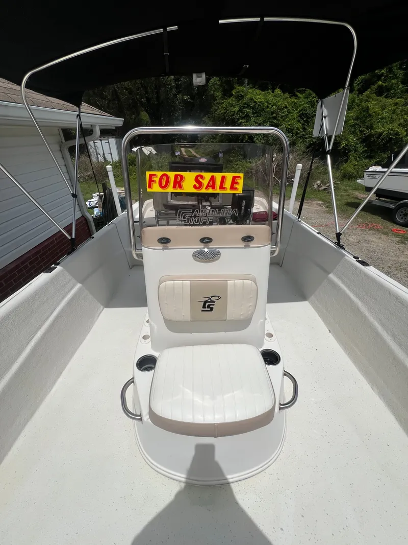 Slide: The Image of 2015 Carolina Skiff 218 DLV boat with "For Sale" sign. - 16