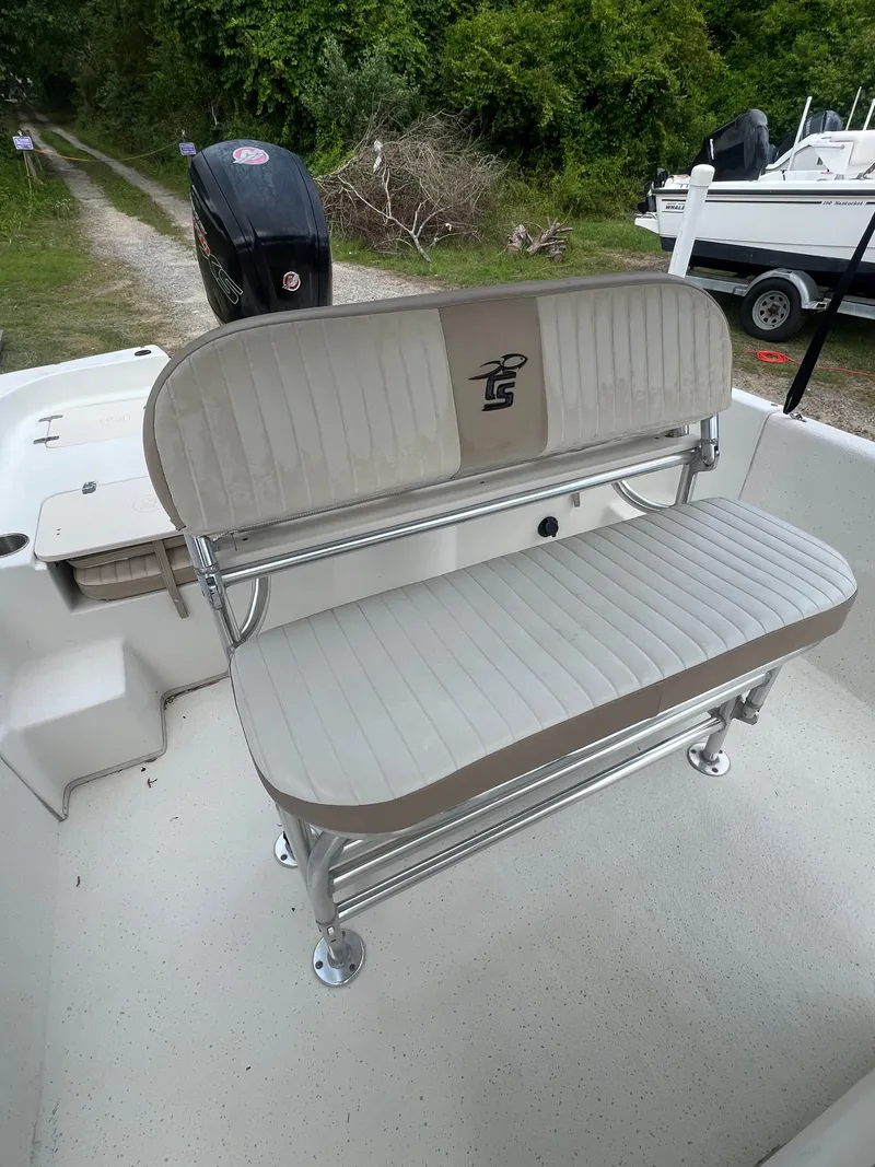 Slide: The Image of 2015 Carolina Skiff 218 DLV boat bench seat on deck. - 18