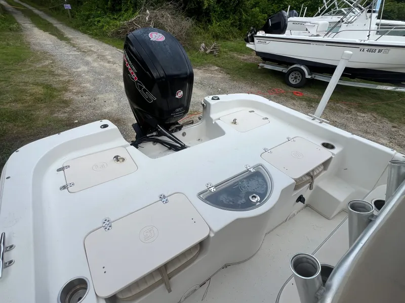 Slide: The Image of 2015 Carolina Skiff 218 DLV boat with outboard motor. - 7