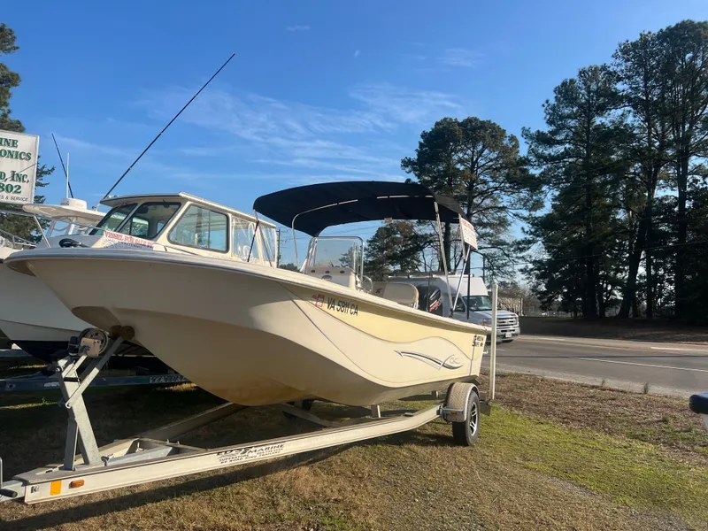 Slide: The Image of 2017 Carolina Skiff 218 DLV boat on trailer, sunny day. - 2