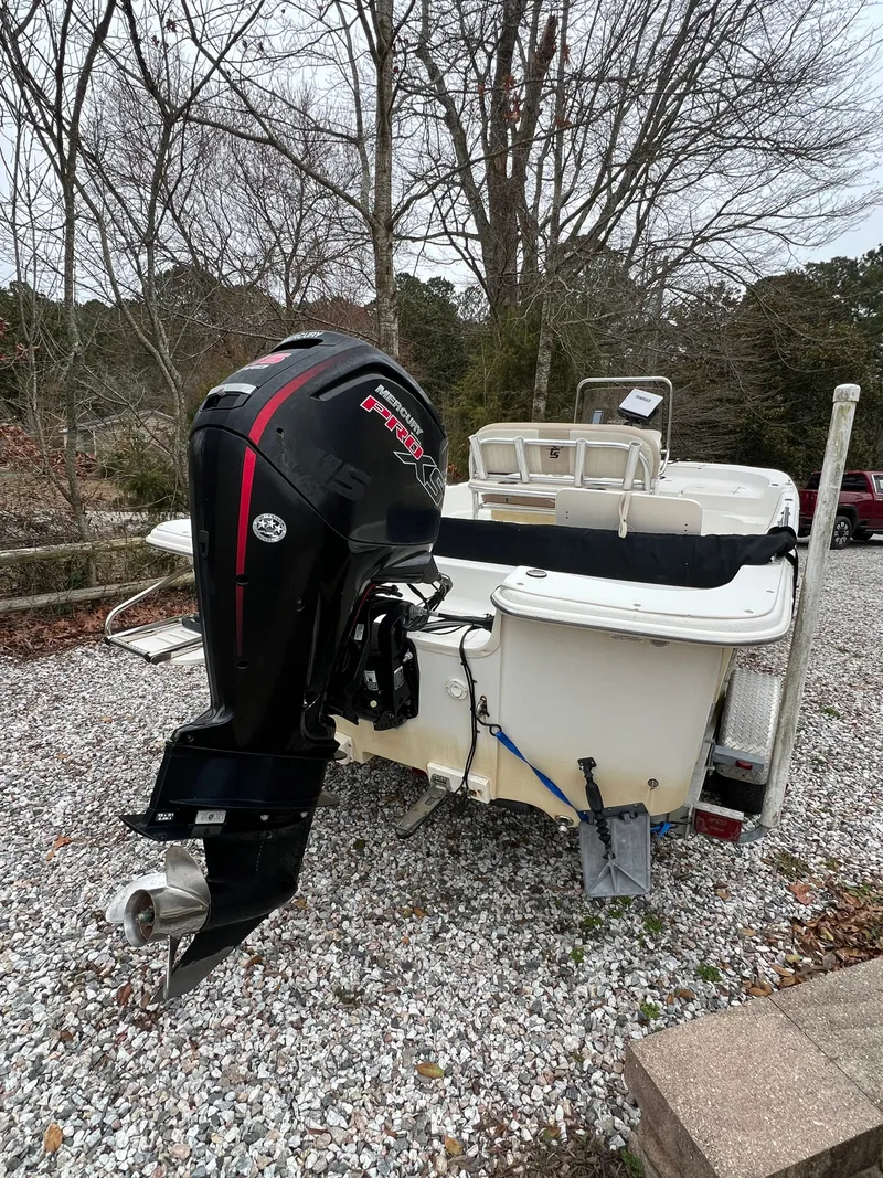 Slide: The Image of 2017 Carolina Skiff 218 DLV boat with outboard motor. - 4