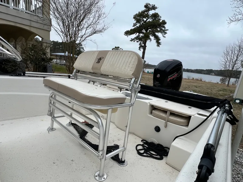 Slide: The Image of 2017 Carolina Skiff 218 DLV boat with bench seat and outboard motor. - 6