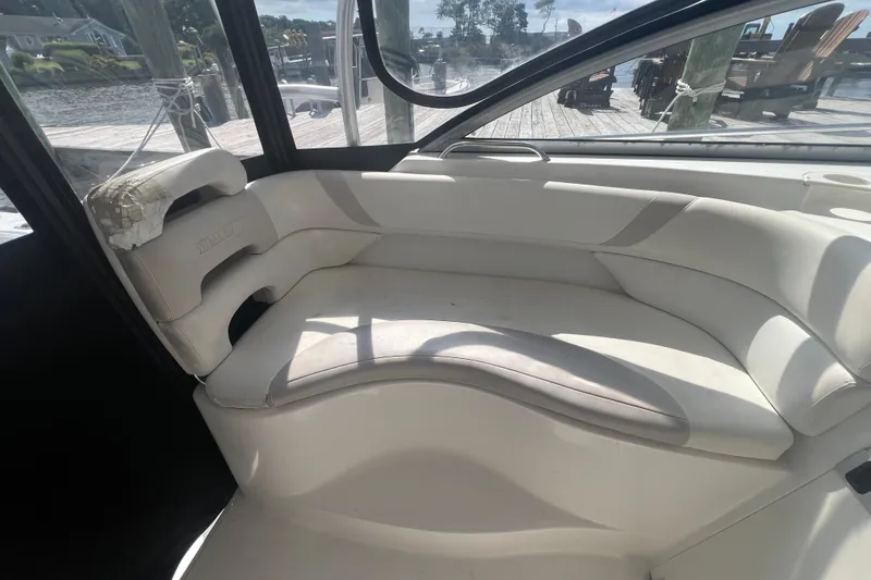 Slide: The Image of Interior seating of a 2004 Boston Whaler 305 Conquest boat, dockside view. - 11