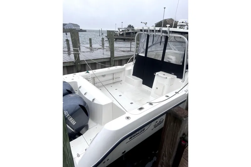 Slide: The Image of Boston Whaler 305 Conquest 2004 at dock with Yamaha engines. - 19