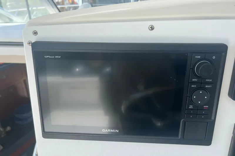 Slide: The Image of Garmin GPSmap XSV on 2004 Boston Whaler 305 Conquest boat dashboard. - 24