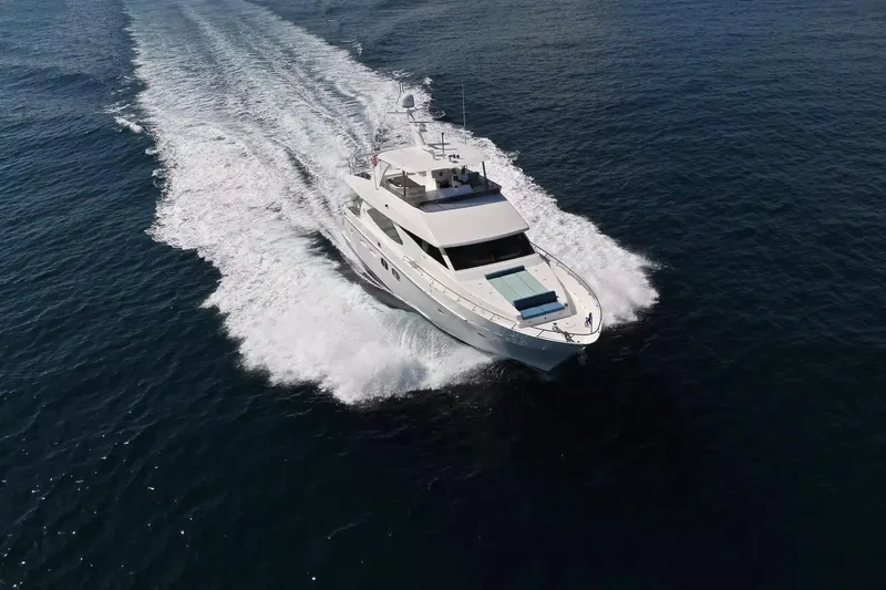 The Image of Luxurious 2015 Hargrave 76 yacht cruising on open water, aerial view. - 1