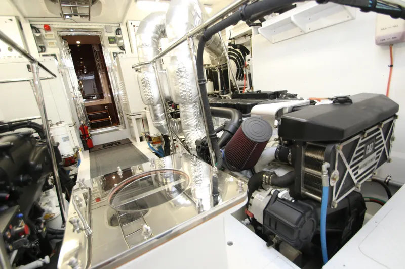 Slide: The Image of Engine room of 2015 Hargrave 76 yacht, featuring advanced machinery and equipment. - 11