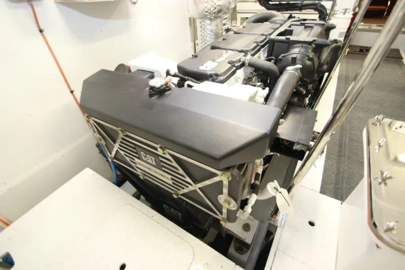 Slide: The Image of Engine room of 2015 Hargrave 76 yacht featuring a CAT engine. - 12