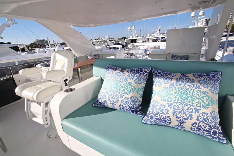 Slide: The Image of Luxurious 2015 Hargrave 76 yacht interior with elegant seating and decorative pillows. - 16