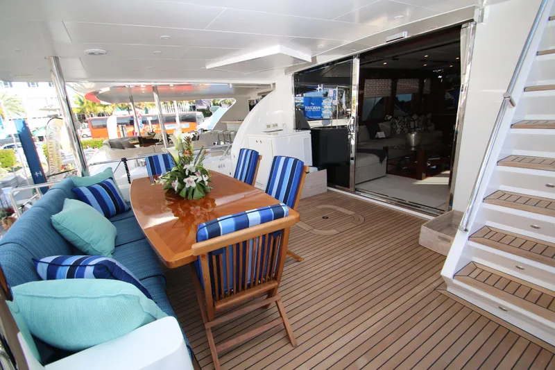 Slide: The Image of Luxurious 2015 Hargrave 76 yacht deck with elegant dining area and plush seating. - 20