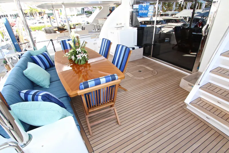 Slide: The Image of Luxurious 2015 Hargrave 76 yacht deck with elegant dining area and striped cushions. - 22