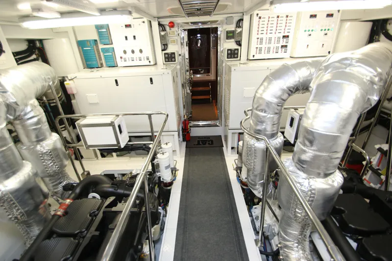 Slide: The Image of Engine room of 2015 Hargrave 76 yacht, featuring advanced machinery and control panels. - 3