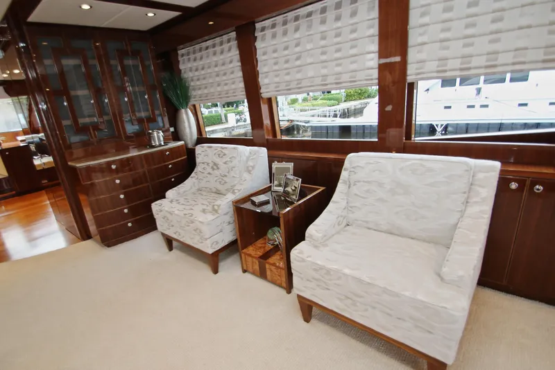 Slide: The Image of Luxurious interior of 2015 Hargrave 76 yacht with elegant seating and wooden cabinetry. - 32