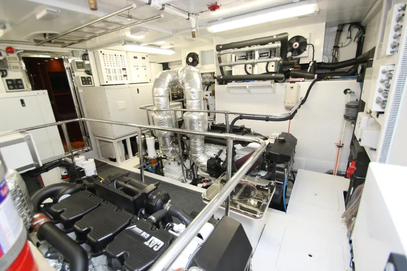 Slide: The Image of Engine room of 2015 Hargrave 76 yacht, featuring advanced machinery and control systems. - 4