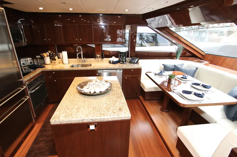 Slide: The Image of Luxurious 2015 Hargrave 76 yacht kitchen with granite countertops and elegant dining area. - 43