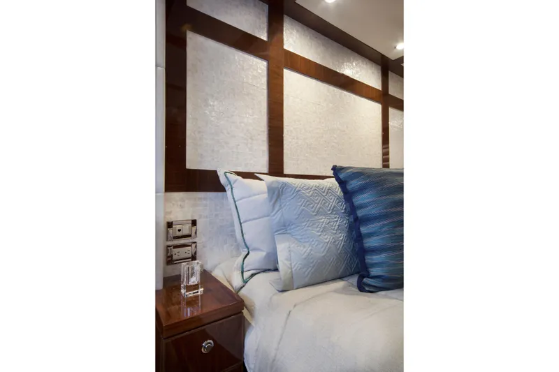 Slide: The Image of Luxurious bedroom interior of 2015 Hargrave 76 yacht with elegant pillows and wood accents. - 46
