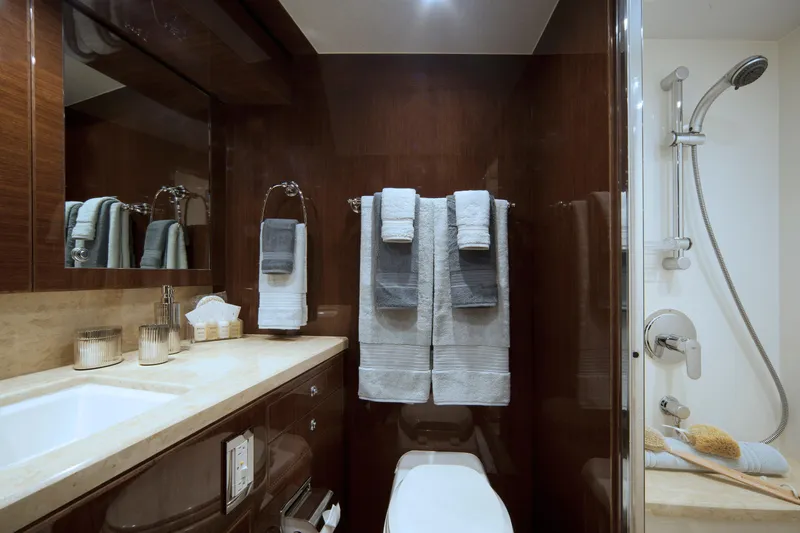 Slide: The Image of Luxurious bathroom in 2015 Hargrave 76 yacht with elegant fixtures and plush towels. - 48
