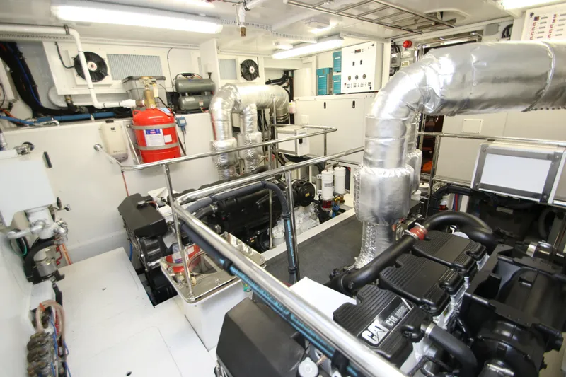 Slide: The Image of Engine room of 2015 Hargrave 76 yacht, featuring advanced machinery and equipment. - 5