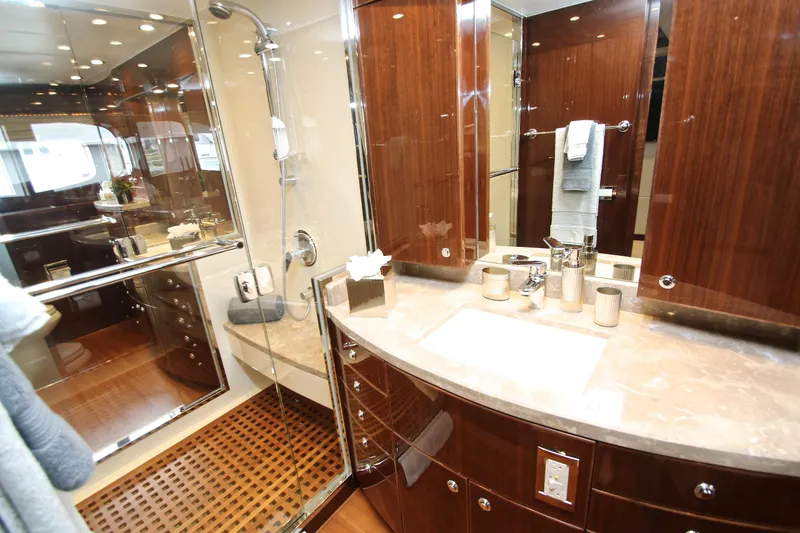 Slide: The Image of Luxurious bathroom in 2015 Hargrave 76 yacht with elegant wood finishes and modern fixtures. - 52