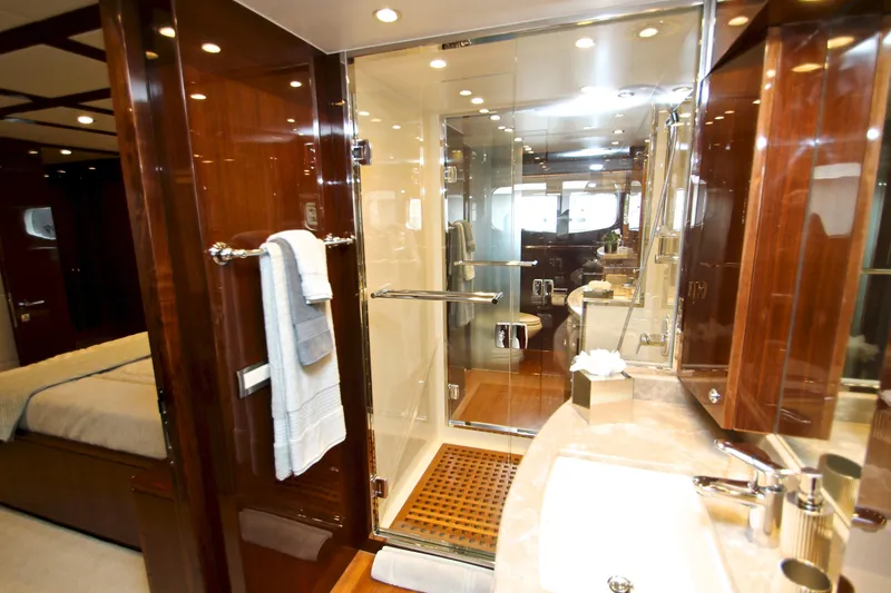 Slide: The Image of Luxurious bathroom interior of 2015 Hargrave 76 yacht with glass shower and wooden accents. - 53