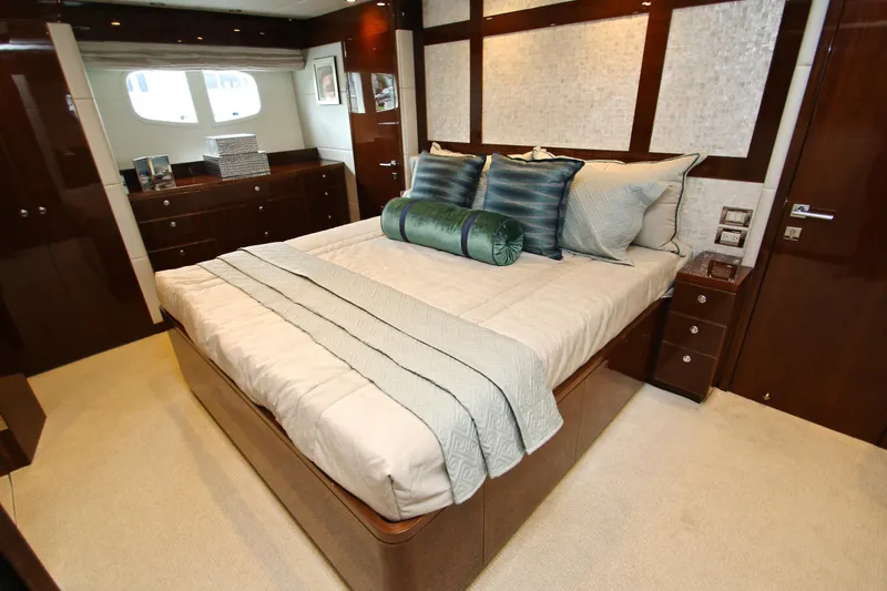 Slide: The Image of Luxurious bedroom interior on 2015 Hargrave 76 yacht with elegant bedding and wood finishes. - 56