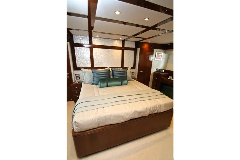 Slide: The Image of Luxurious bedroom interior on 2015 Hargrave 76 yacht, featuring elegant bedding and modern design. - 59