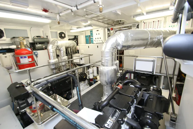 Slide: The Image of Engine room of 2015 Hargrave 76 yacht, featuring advanced machinery and equipment. - 6
