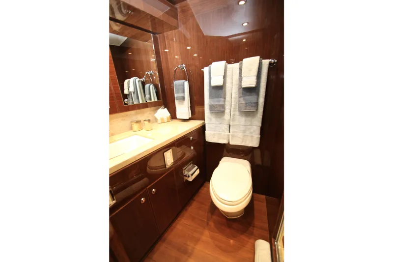 Slide: The Image of Luxurious bathroom in 2015 Hargrave 76 yacht with elegant wood finishes and modern amenities. - 60