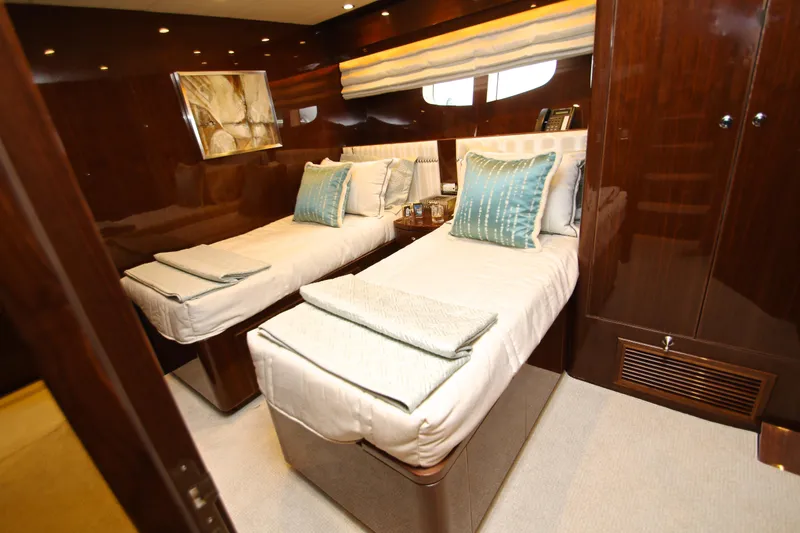 Slide: The Image of Luxurious twin cabin interior on 2015 Hargrave 76 yacht, featuring elegant bedding and wood finishes. - 64