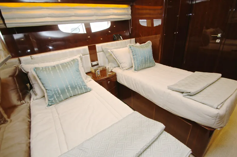 Slide: The Image of Luxurious twin cabin interior on 2015 Hargrave 76 yacht, featuring elegant bedding and wood finishes. - 67