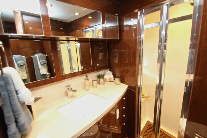 Slide: The Image of Luxurious bathroom in 2015 Hargrave 76 yacht with elegant wood finishes and modern fixtures. - 68