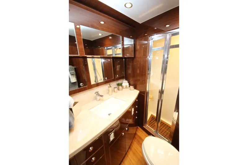 Slide: The Image of Luxurious bathroom in 2015 Hargrave 76 yacht with wood accents and modern fixtures. - 69