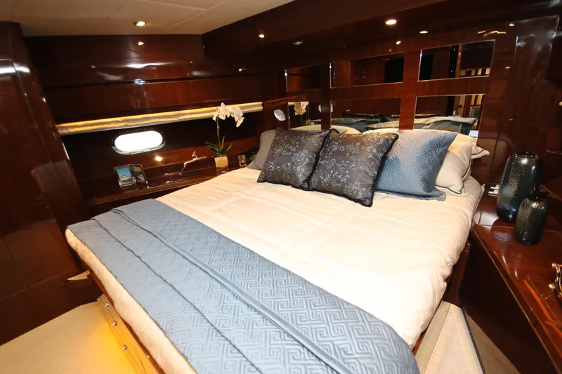 Slide: The Image of Luxurious bedroom interior of 2015 Hargrave 76 yacht with elegant bedding and wood finish. - 71