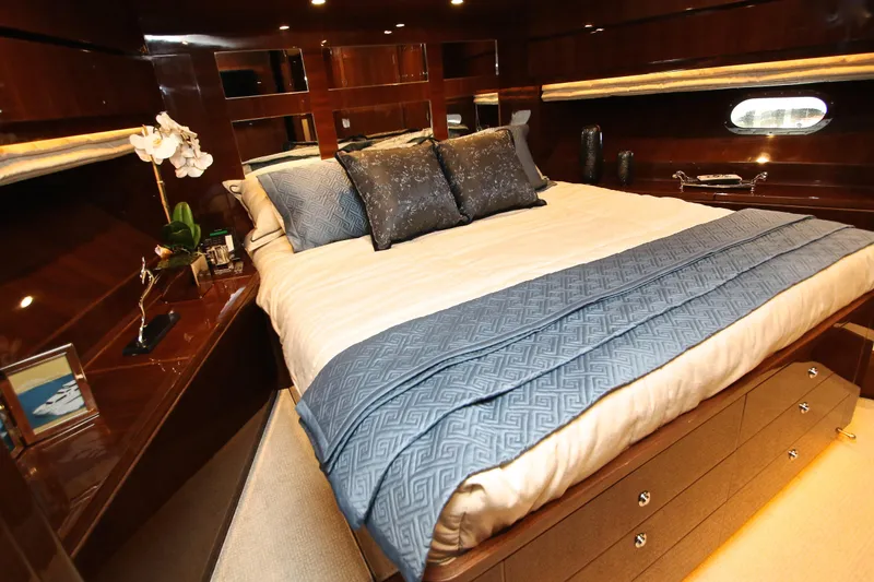 Slide: The Image of Luxurious bedroom interior of 2015 Hargrave 76 yacht with elegant bedding and wood finishes. - 73