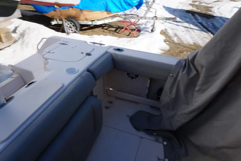 Slide: The Image of 2011 Grady-White Freedom 255 boat interior with snow-covered surroundings. - 16