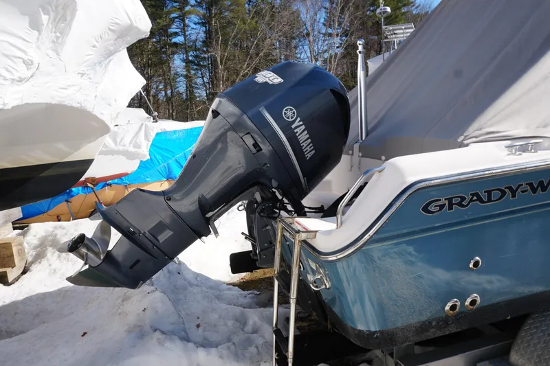 Slide: The Image of 2011 Grady-White Freedom 255 boat with Yamaha outboard motor in snowy setting. - 19