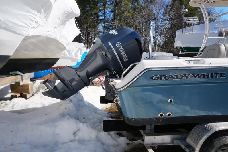 Slide: The Image of 2011 Grady-White Freedom 255 boat with Yamaha outboard motor in snowy setting. - 3