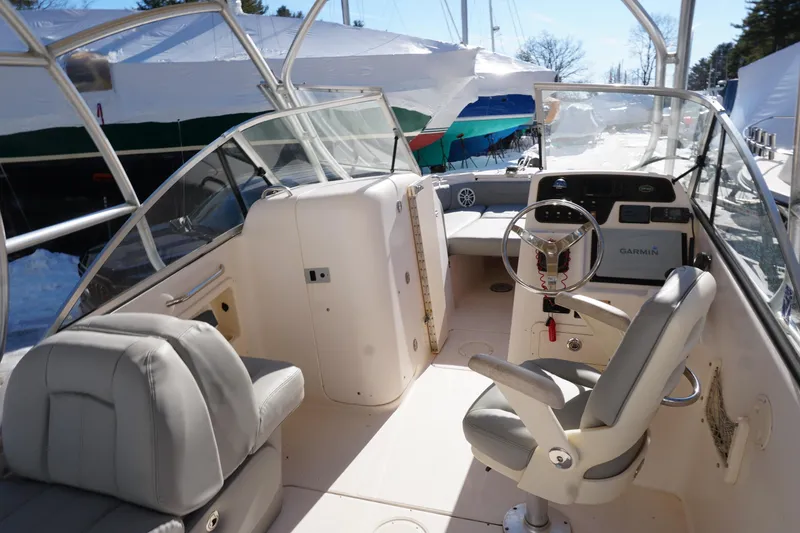 Slide: The Image of 2011 Grady-White Freedom 255 boat interior with steering wheel and seating. - 5