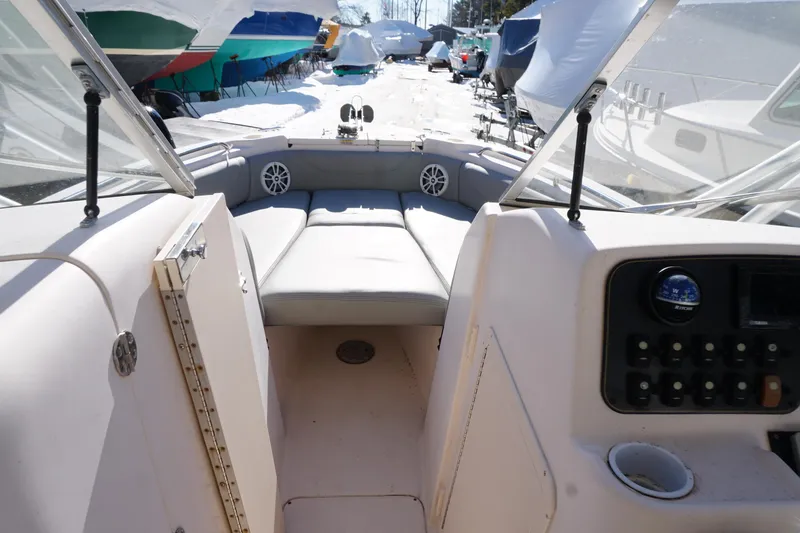 Slide: The Image of 2011 Grady-White Freedom 255 boat interior with seating and control panel. - 6