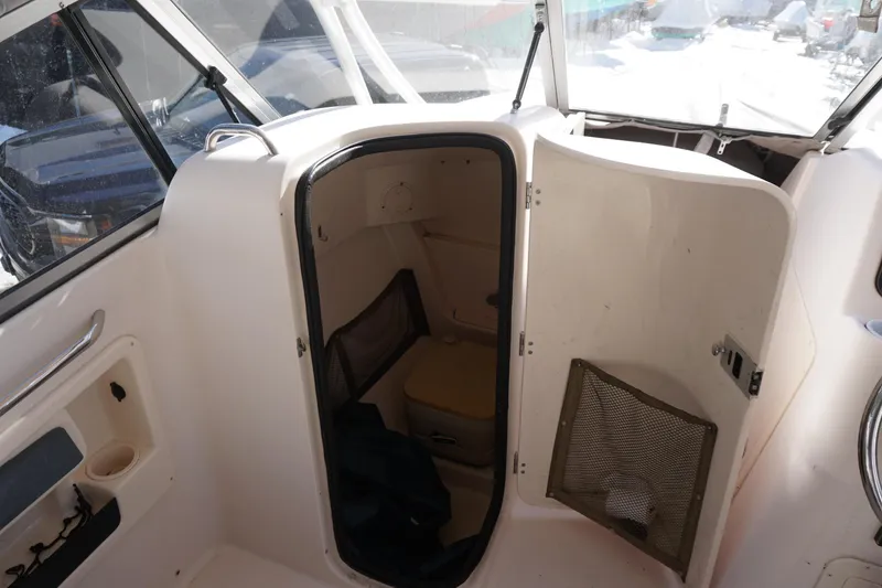 Slide: The Image of 2011 Grady-White Freedom 255 boat interior with open cabin door. - 7
