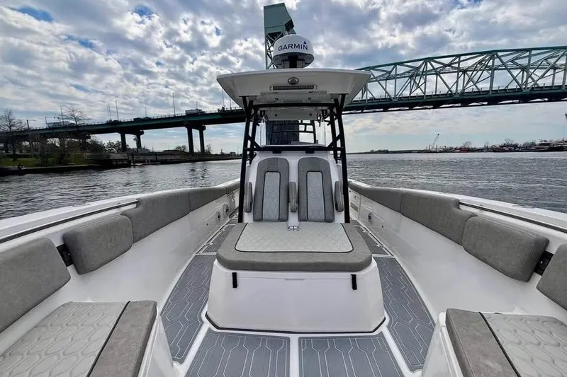 Slide: The Image of 2023 Sea Fox 328 Commander boat interior with bridge view, featuring cushioned seating and modern design. - 11