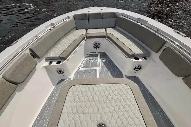 Slide: The Image of 2023 Sea Fox 328 Commander boat interior with cushioned seating and modern design. - 12