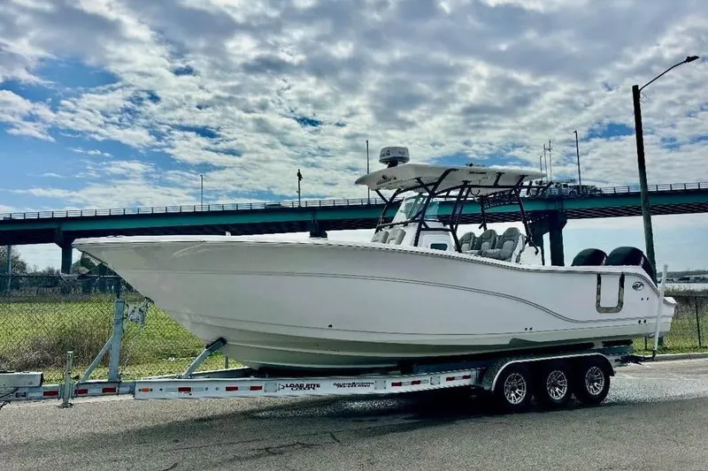 Slide: The Image of 2023 Sea Fox 328 Commander boat on trailer under cloudy sky. - 4
