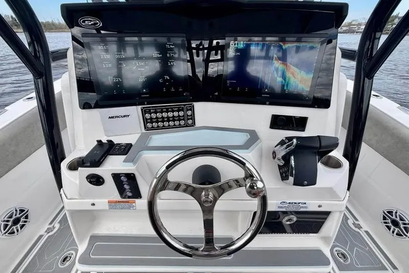 Slide: The Image of 2023 Sea Fox 328 Commander boat dashboard with advanced navigation displays and controls. - 5