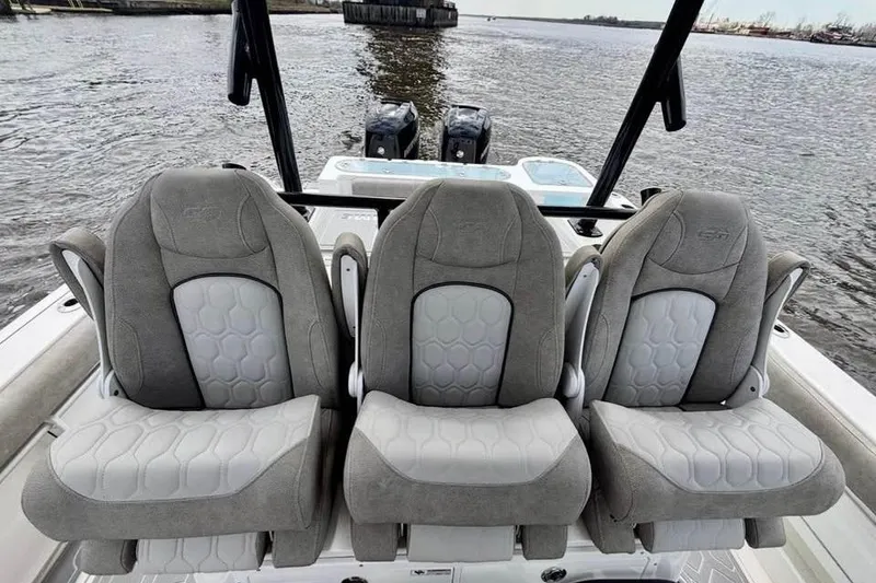 Slide: The Image of 2023 Sea Fox 328 Commander boat seats with water view in the background. - 6