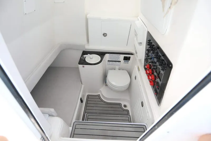 Slide: The Image of Manufacturer Provided Image: 2023 Sea Fox 328 Commander boat interior with toilet and control panel. - 8